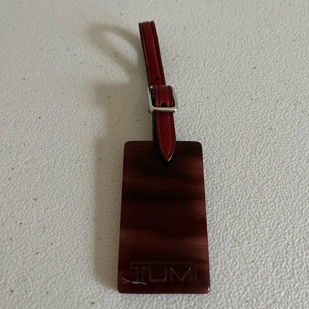Tumi Red and Brown Luggage tag